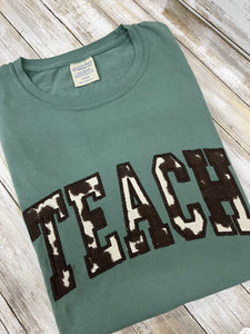 Cow Print "TEACH" Shirt